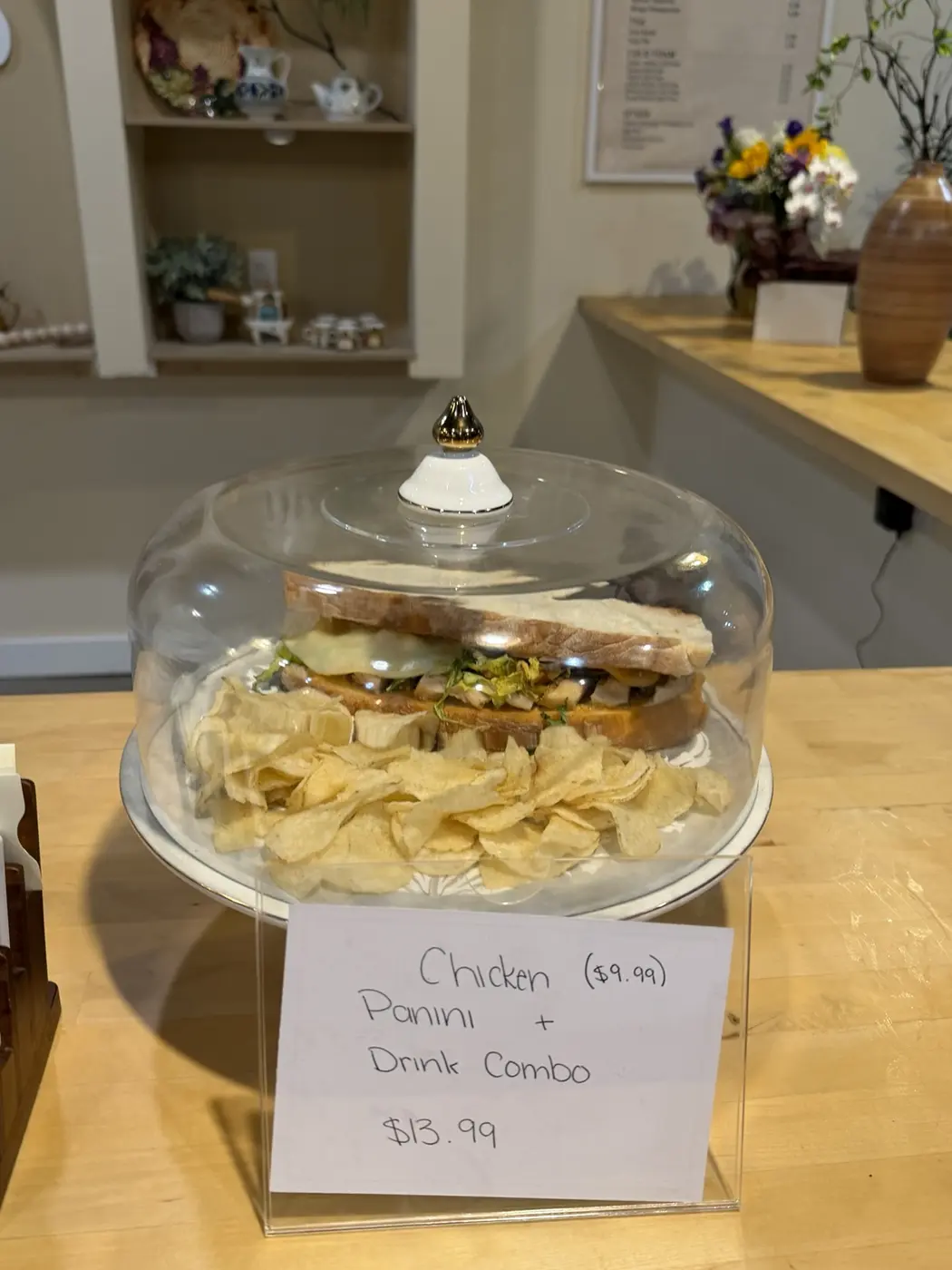 A chicken panini served with chips