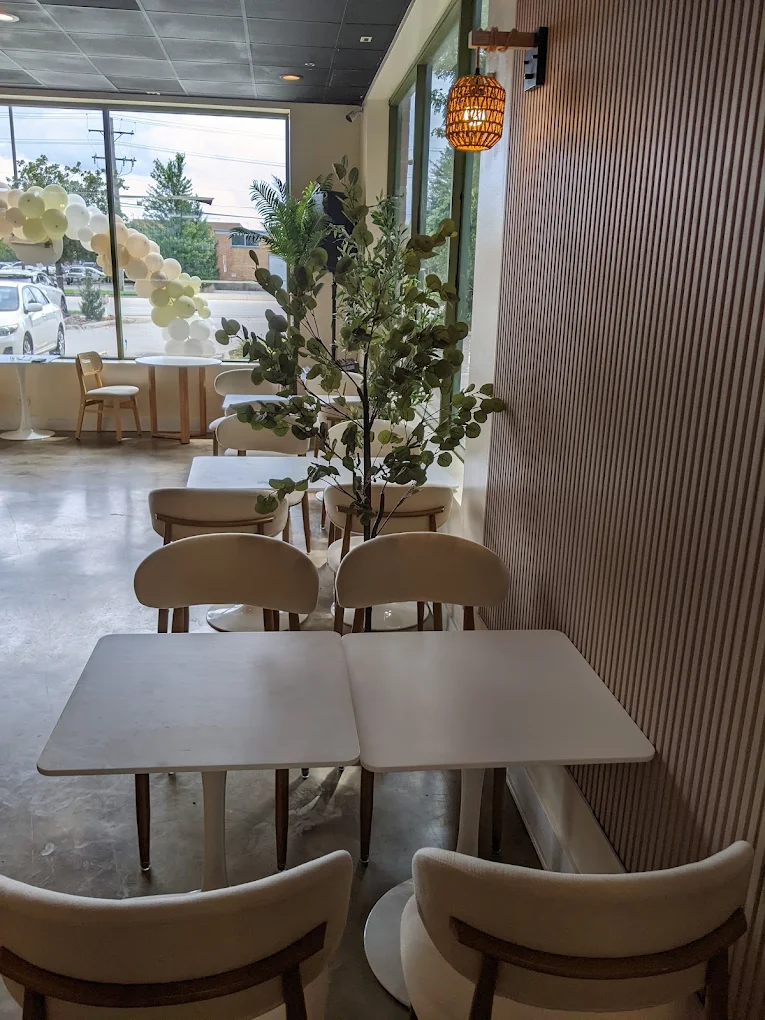 Tables and chairs along the window at Meso Cafe